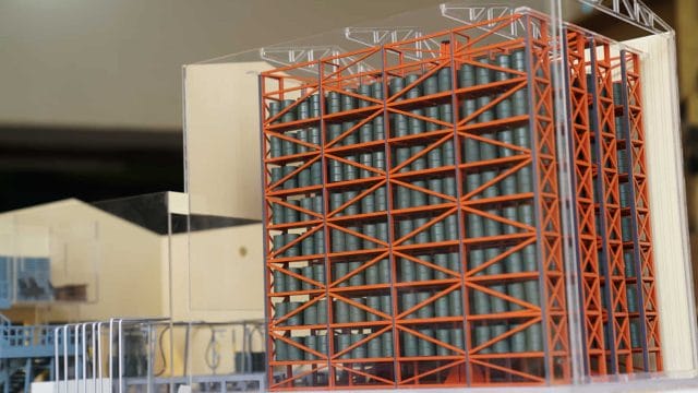 Beige oil depot model with orange structural framework at Jaisalmer site.