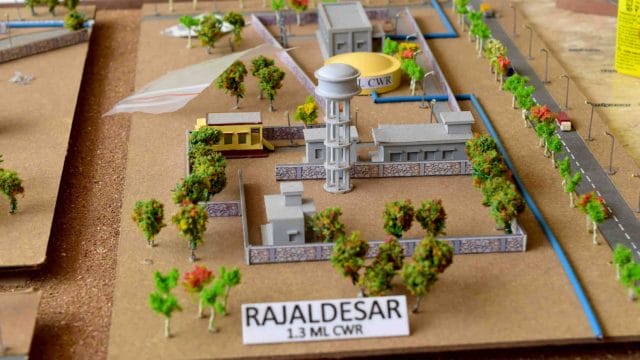Affordable water treatment plant model with tanks and pipelines for NCC Ratangarh project.