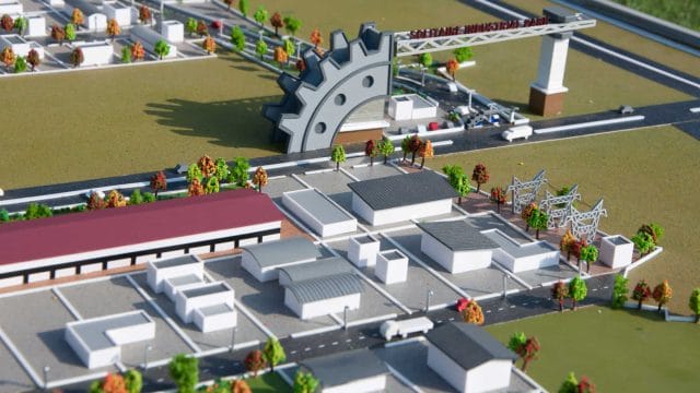 A lush industrial park with modern buildings and infrastructure in a well-planned development.