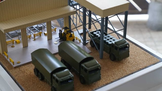 Miniature oil depot model with trucks and storage tanks for Jaisalmer project.