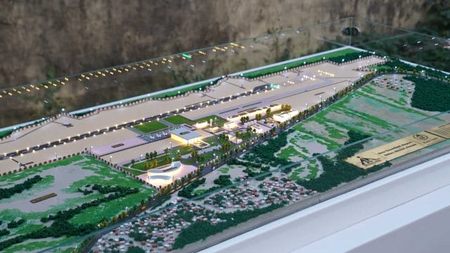 Beige Newt model of Dolo Airport, Silchar, showing detailed airport layout and surrounding landscape.