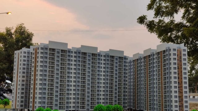 Beige Newt model of a modern residential apartment complex in Ahmedabad.