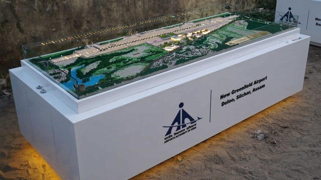 A detailed scale model of Dolo Airport, Silchar, Assam, showcasing the new greenfield airport develo.