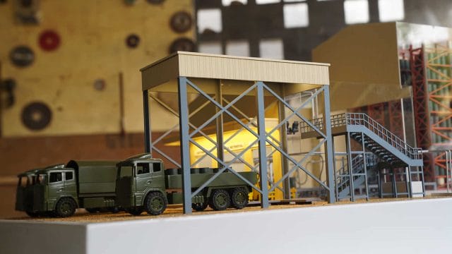 Model of an oil depot with trucks at Jaisalmer, showcasing industrial infrastructure.