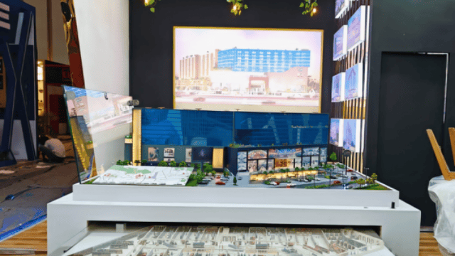 Modern real estate model display at 52 GT South City, Jaipur showcasing urban development and reside.