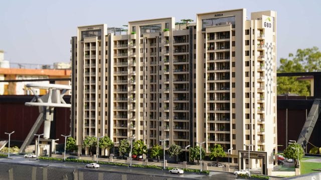 Modern residential building model with multiple floors and balconies, showcasing contemporary archit.