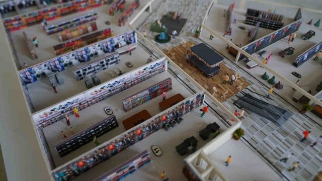 Beige Newt miniature model of a trade exhibition booth layout at 64 GT South City.