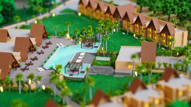 A lush resort with swimming pools, tropical landscaping, and bungalow-style accommodations.
