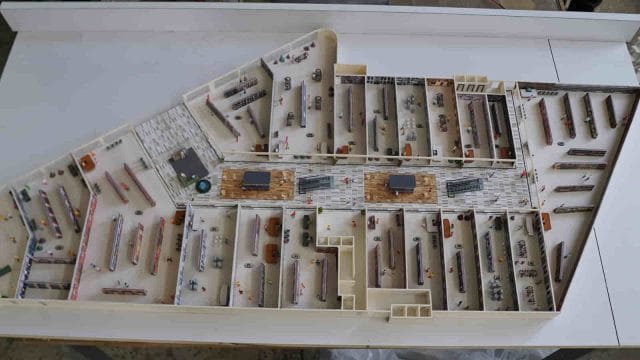 Beige Newt model display for 64 GT South City exhibition, showcasing detailed miniature vehicles and.